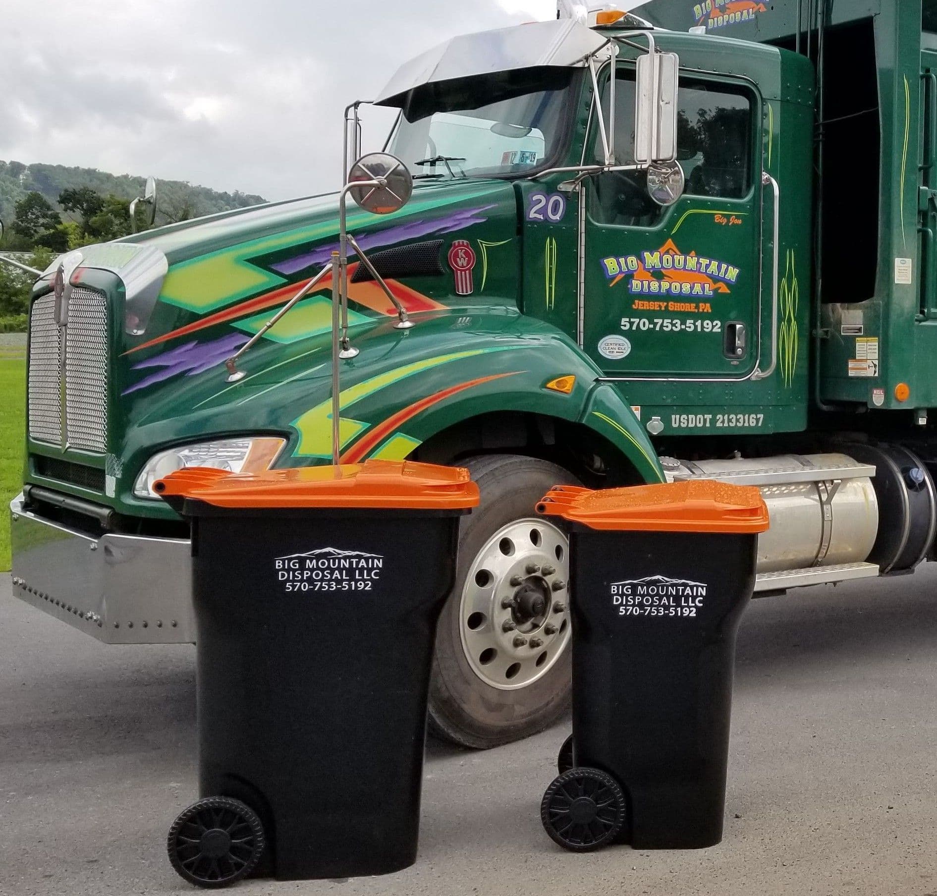 Big Mountain Disposal truck delivering a dumpster